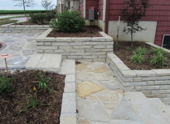 Natural stone walkways and retaining wall planters