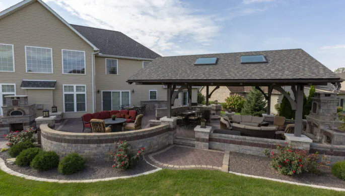 A beautifully designed and intricately maintained exterior, lending to exceptional outdoor living, with designs from Mark Hoerr Landscaping