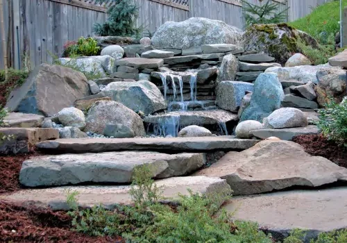 A garden waterfall designed by Mark Hoerr Landscaping
