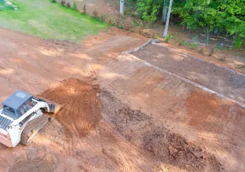 Grading 1 Mark Hoerr Landscaping using a tractor to perform professional Grading in Peoria IL