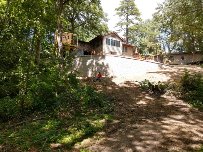 A large retaining wall in the back of a property, installed by Mark Hoerr Landscaping