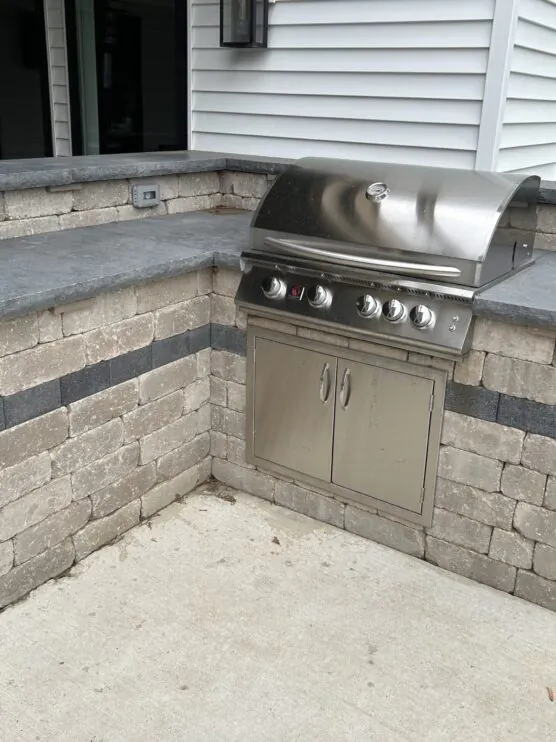 A grill and countertop outside part of outdoor kitchens designed by Mark Hoerr Landscaping in Peoria IL