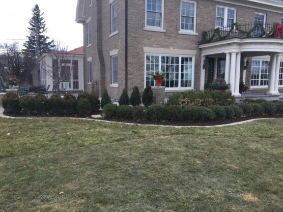 A stunning residential yard transformation featuring custom plantings by a professional landscaper East Peoria IL.
